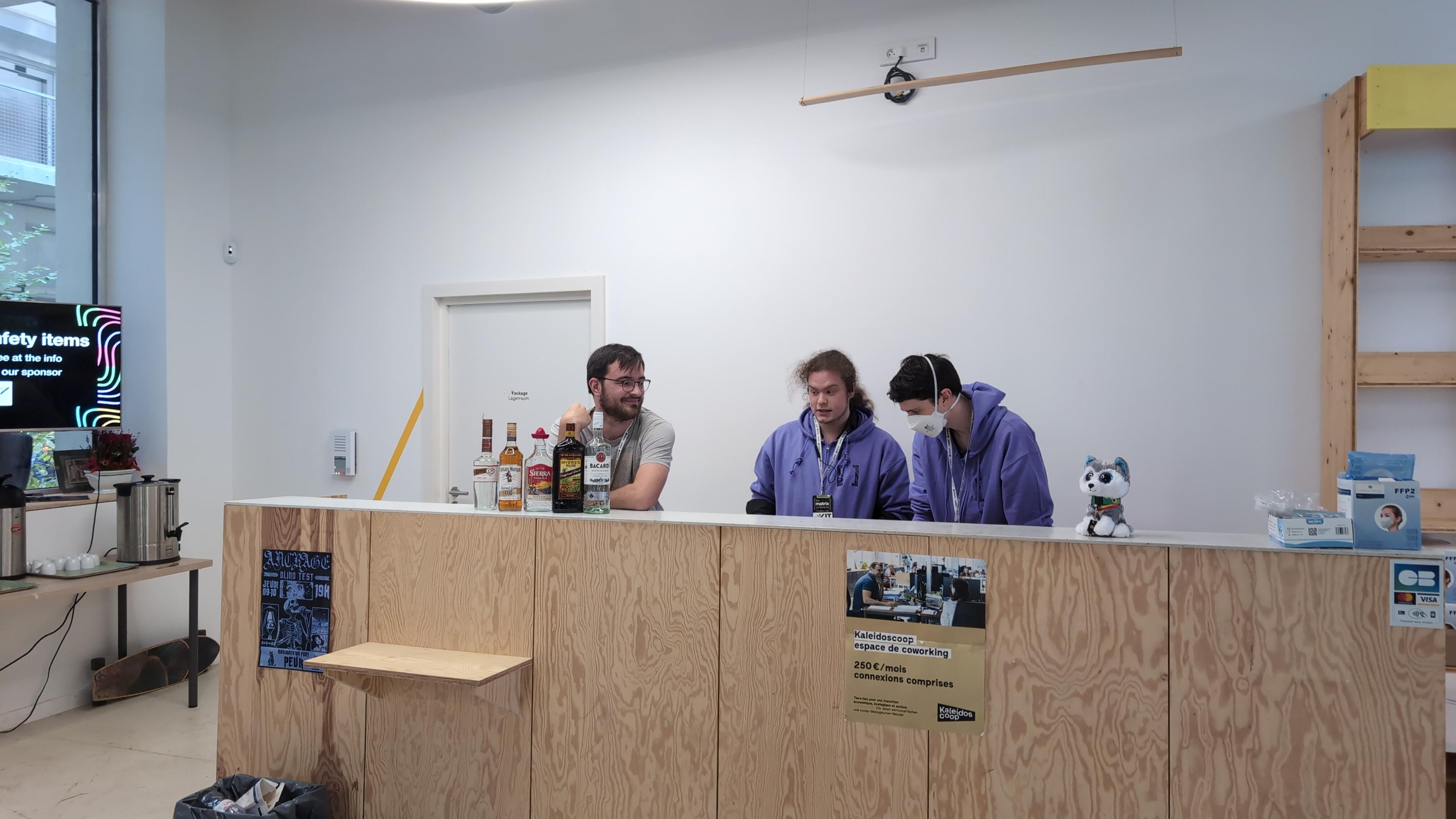Volunteers preparing the bar for cocktails.